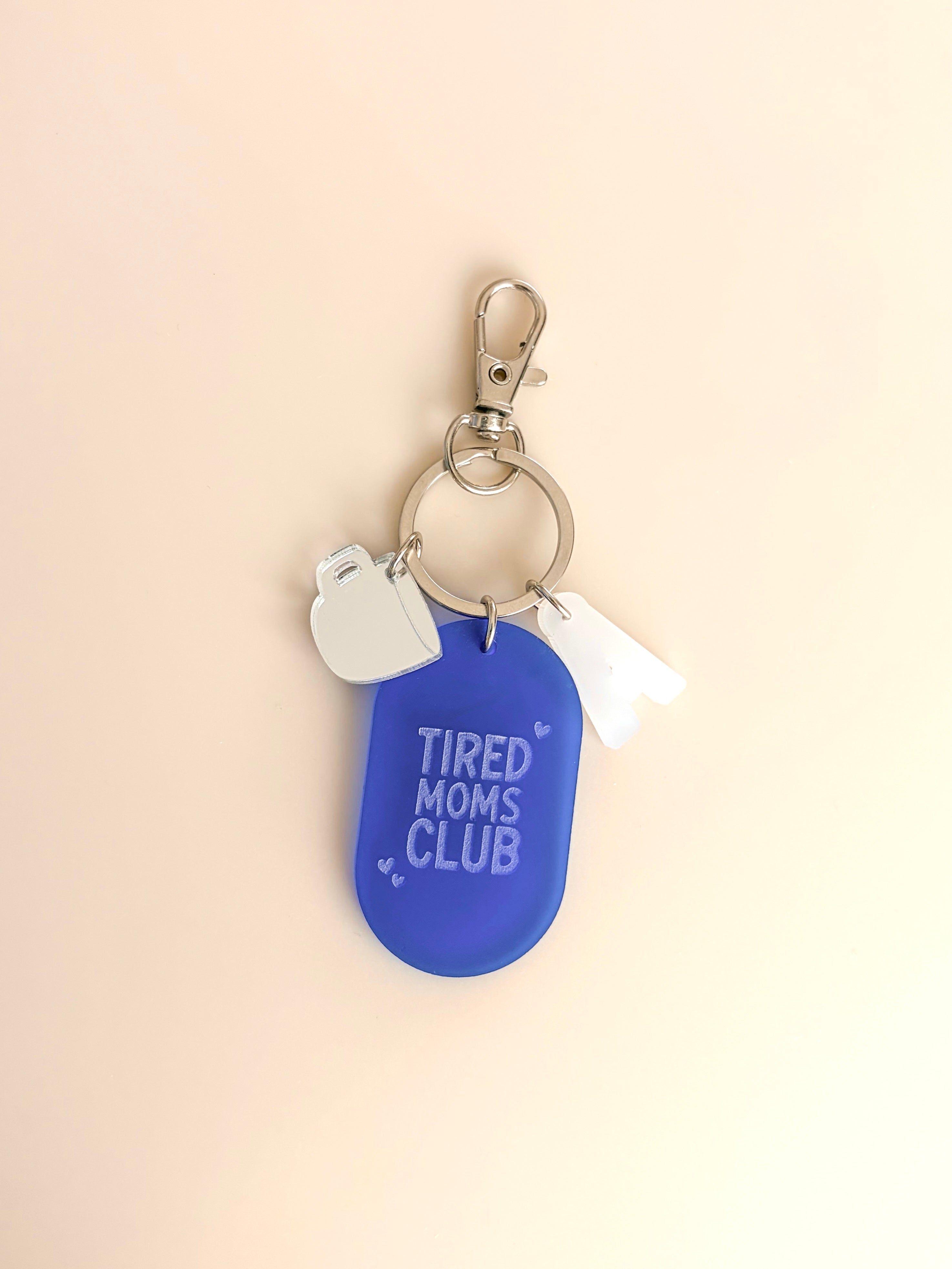 Porte-clés grigri Tired Moms Club
